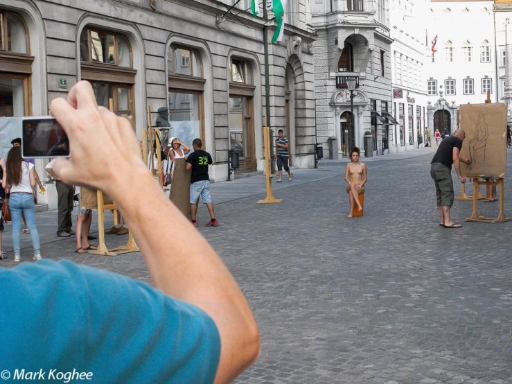 In Ljubljana anything can happen. A lady poses naked for an art class in the centre of town on August 21.