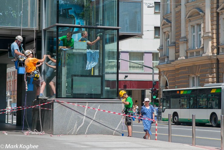 Windowwipers clean a glass tower on Slovenska Cesta in  Ljubljana on June 20.  They don't use scaffolding or ladders but a solid rope-access.