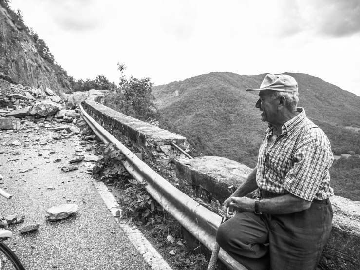 ,,Is it dangerous'', we asked the man. ,,I think so'', he said. ,,Can we go through'', we asked. ,,I don't know'', he answered. ,,Howcome you dont know?'' ,,I came here to watch not to stand guard.''